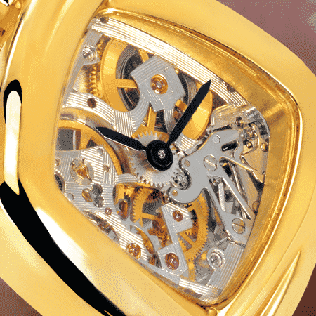 skeleton watch for women - Dentelle cascade dorée: Mechanical gold watch (Piguet movement), black hands, gold cabochon with a ruby, yellow gold cascade bracelet