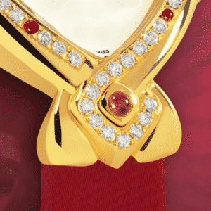 feminine watch - Dhana Laxmi : Gold watch set with 43 diamonds and 7 rubys, white mother-of pearl dial, gold-plated hands, gold cabochon with a ruby, red satin strap