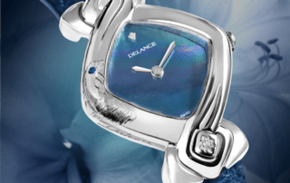 Original womens watch - Dolphin: Steel watch, blue mother-of-pearl dial, nickel-plated hands, steel cabochon with a diamond, blue alligator strap, engraved with a dolphin and set with a sapphire at 10 o'glock