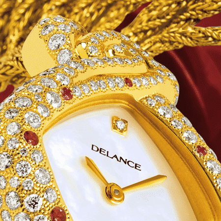feminine watch - Mahalaxmi: Gold watch set with 235 diamonds and 6 rubies, white mother-of-pearl dial with a diamond index, gold-plated hands, gold cabochon with a ruby, gold cascade strap