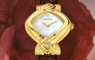 My Mother's Watch : Montre en or sertie de 12 diamants et 5 rubis, cadran nacre blanche, aiguilles dorées, cabochon avec 3 diamants en forme de cœur, bracelet en alligator rouge vin