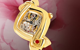 Skeleton watch for women - Dentelle in Gold: Mechanical gold watch (Piguet movement), black hands, gold cabochon with a ruby, red satin strap
